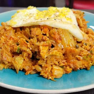 a fried egg on top of rice