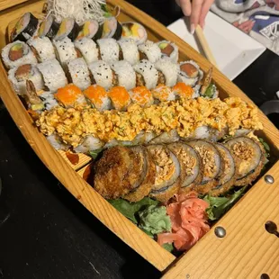 From farthest left to right: futo maki , spicy salmon, spicy tuna, mexican roll, slam dunk, and crispy roll