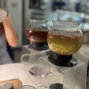 a woman pouring tea into a blender