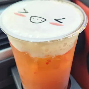 a cup with a face drawn on it