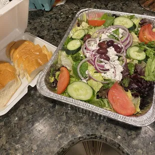 Greek salad w a side of fresh Italian bread