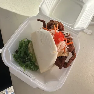 a sandwich in a styrofoam container