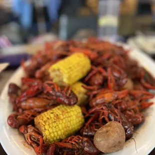 a plate of craws and corn