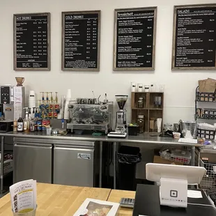 a coffee shop with menus on the wall