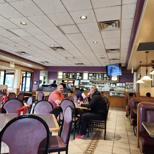 diners sitting at tables in a restaurant