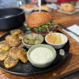 Pulled Meat Burger + smashed potatoes, housemade aioli mayo &amp; pickles