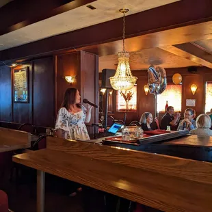 a woman sitting at the bar