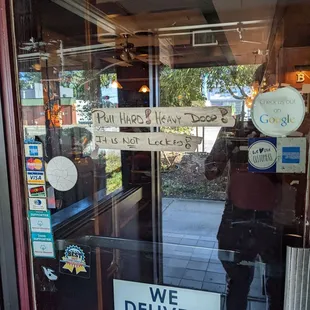 a sign in the window of a restaurant