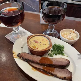 a plate of food and a glass of wine