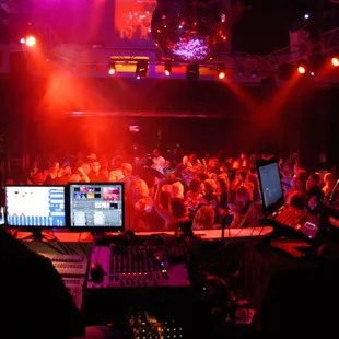 a dj in front of a large crowd