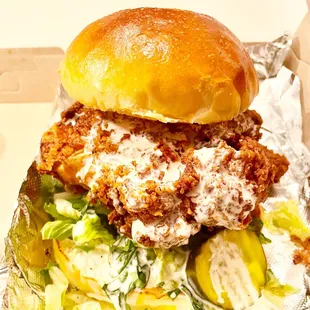 Fried Chicken Sandwich- Lettuce, sweet pickle chips, and white vinegar BBQ sauce.