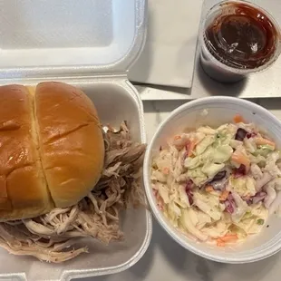 a pulled pork sandwich and coleslaw
