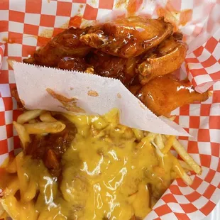 a basket of fries and cheese