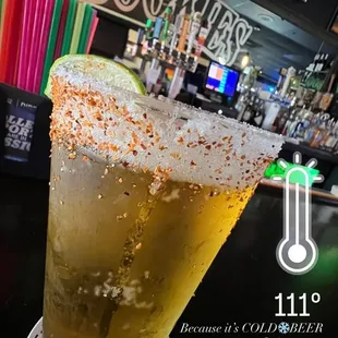a glass of beer on a table