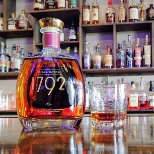 a bottle and two glasses