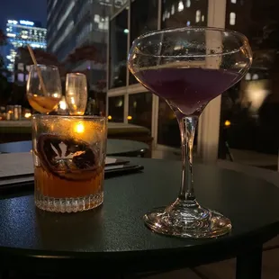 two cocktails on a table at a restaurant