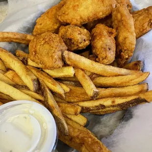 a basket of fried chicken and fries