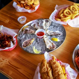 a platter of oysters and fries