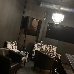 two chairs, a table, and a chandelier