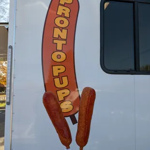 Two Pronto Pups with ketchup brushed on them