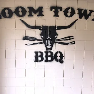 a cow skull on a brick wall