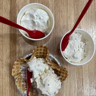 two bowls of ice cream and a waffle cone
