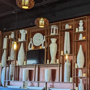 a wall of vases