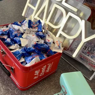 a red lunchbox full of candy