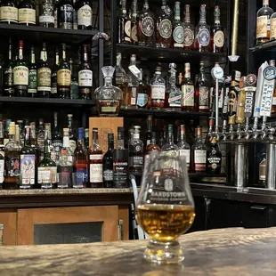 a bar filled with liquor bottles