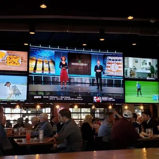 a bar with many televisions