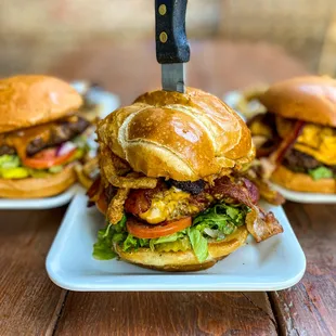 bacon, cheese, lettuce, and tomato on a croissant roll