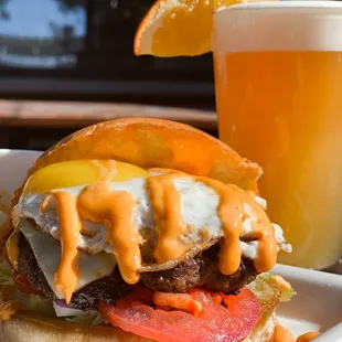 a burger and a glass of beer