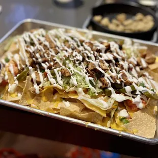 Loaded Chicken Nachos- $13. Super yum!