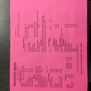a pink piece of paper on a table