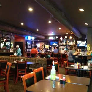 Inside looking across the dining area at the bar, cool lights!