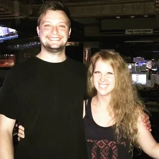 a man and a woman posing for a picture
