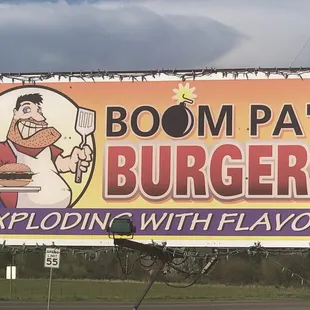 a billboard advertising a burger