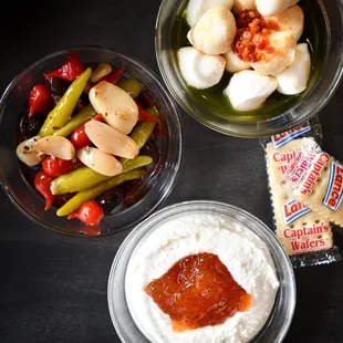 three bowls of food on a table