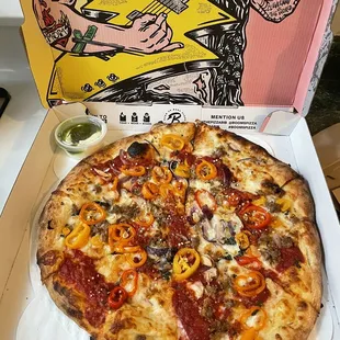 Sausage and Peppers Pizza. Herby garlic sauce in the corner