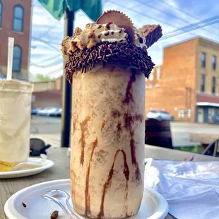 a cup of ice cream with a chocolate topping