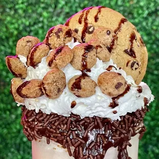 a milkshake with chocolate chips and whipped cream