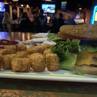 Double smash burger with cheese and tots part of the Covid menu.