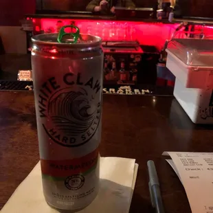 a can of beer on a table