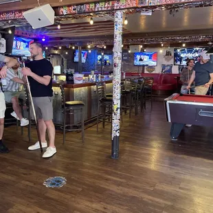 two men playing pool