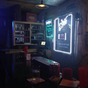 Edge of the bar! They have the best burgers and excellent drinks! Love this place!