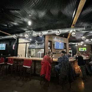 people sitting at a bar