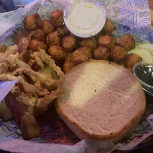 Maciver burger with bourbon glaze on the side, sweet potato tots and seasoned sour cream.