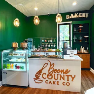 a bakery counter with a variety of pastries