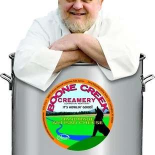 a man leaning on a pot of cream