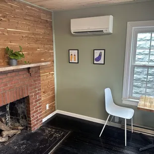 Indoor cozy seating area. Lots of windows and lighting.